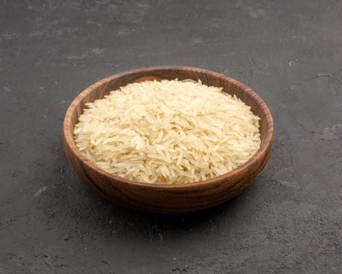 front-view-raw-rice-inside-brown-plate-grey-space